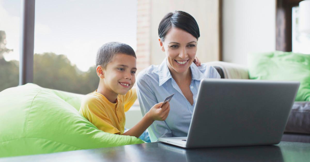 Mother and son looking at laptop