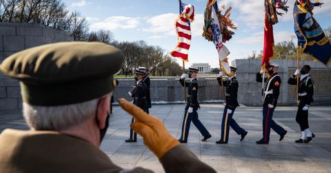 Military veteran saluting the U.S. flag