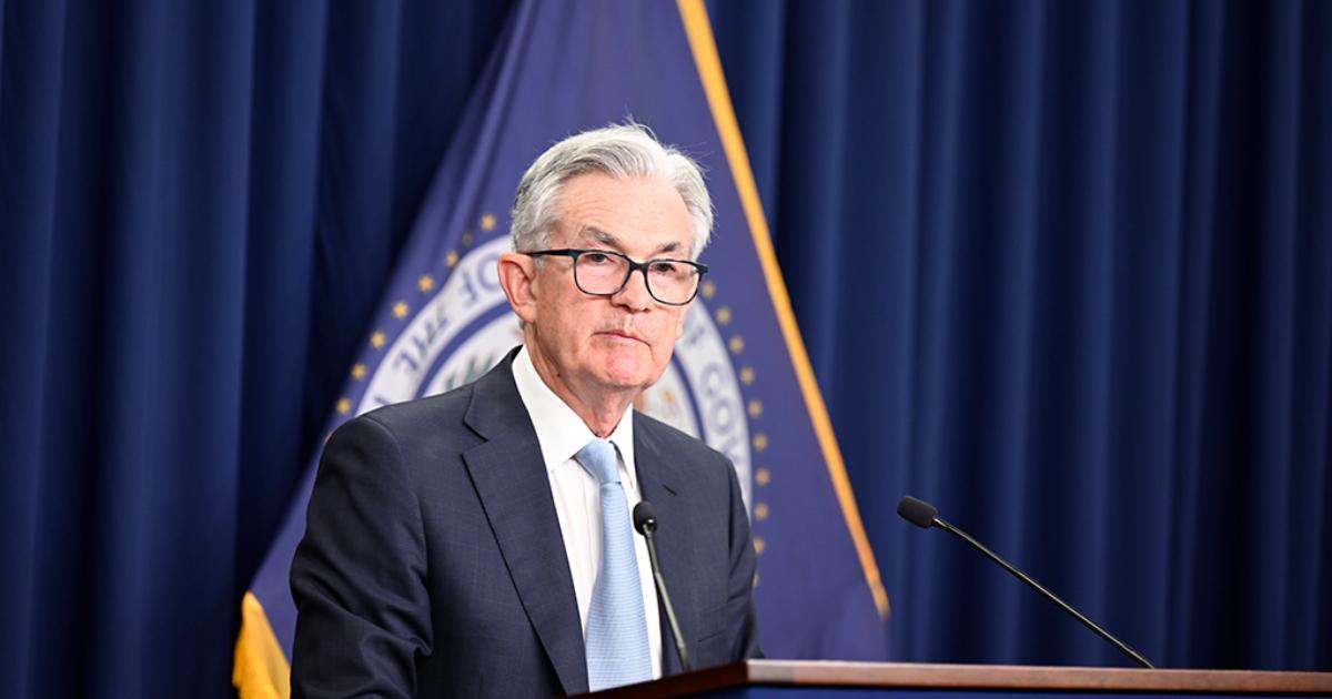 Fed Chair Jerome Powell announcing a rate hike