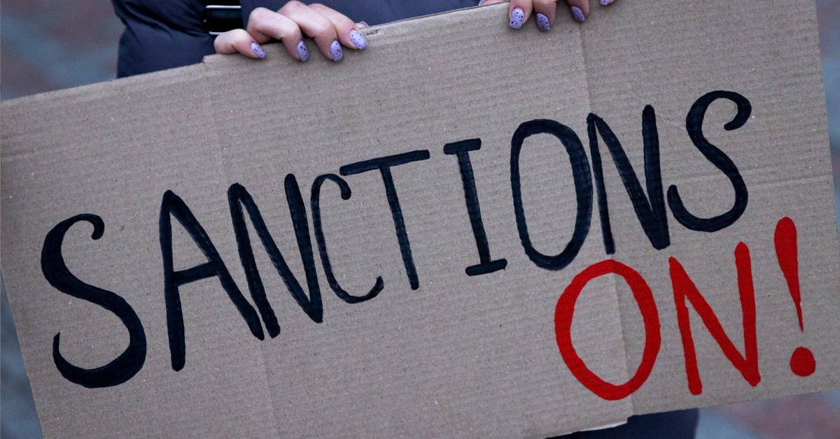 Sanctions protest sign