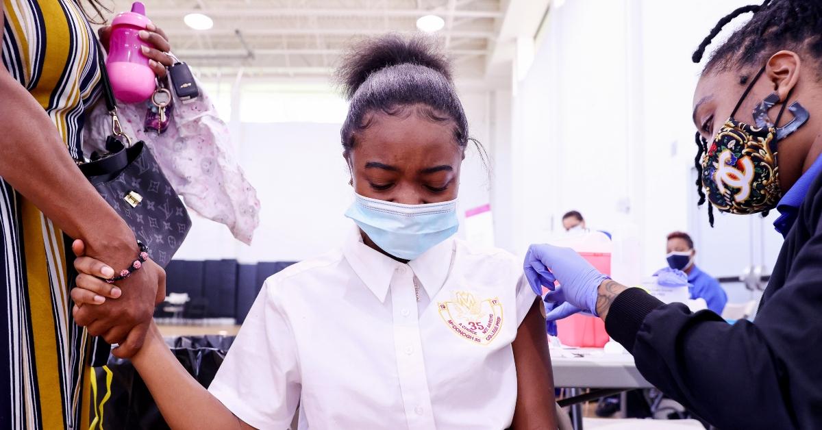 Girl getting a COVID-19 vaccine