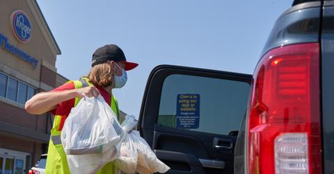 Kroger employee loading groceries in a vehicle