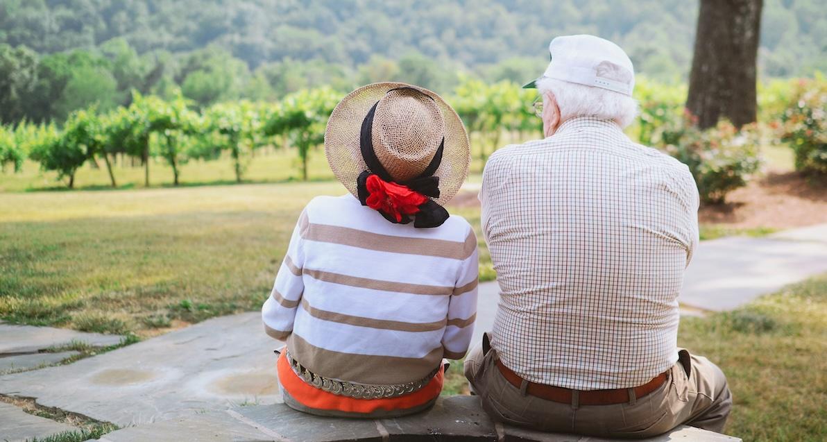 older couple sitting outside