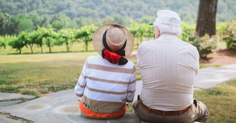 older couple sitting outside