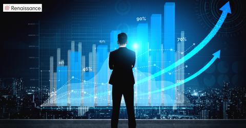 Businessman looking at a chart of financial profit growth of stock market investment.