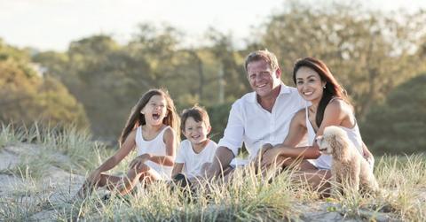 Family sitting together in a field