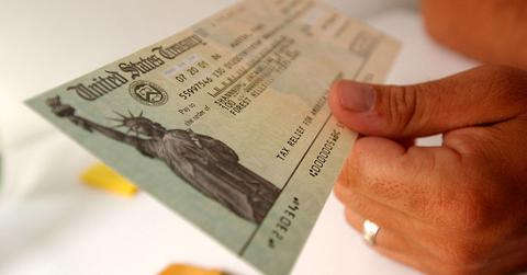 A tax payer looks at his rebate check