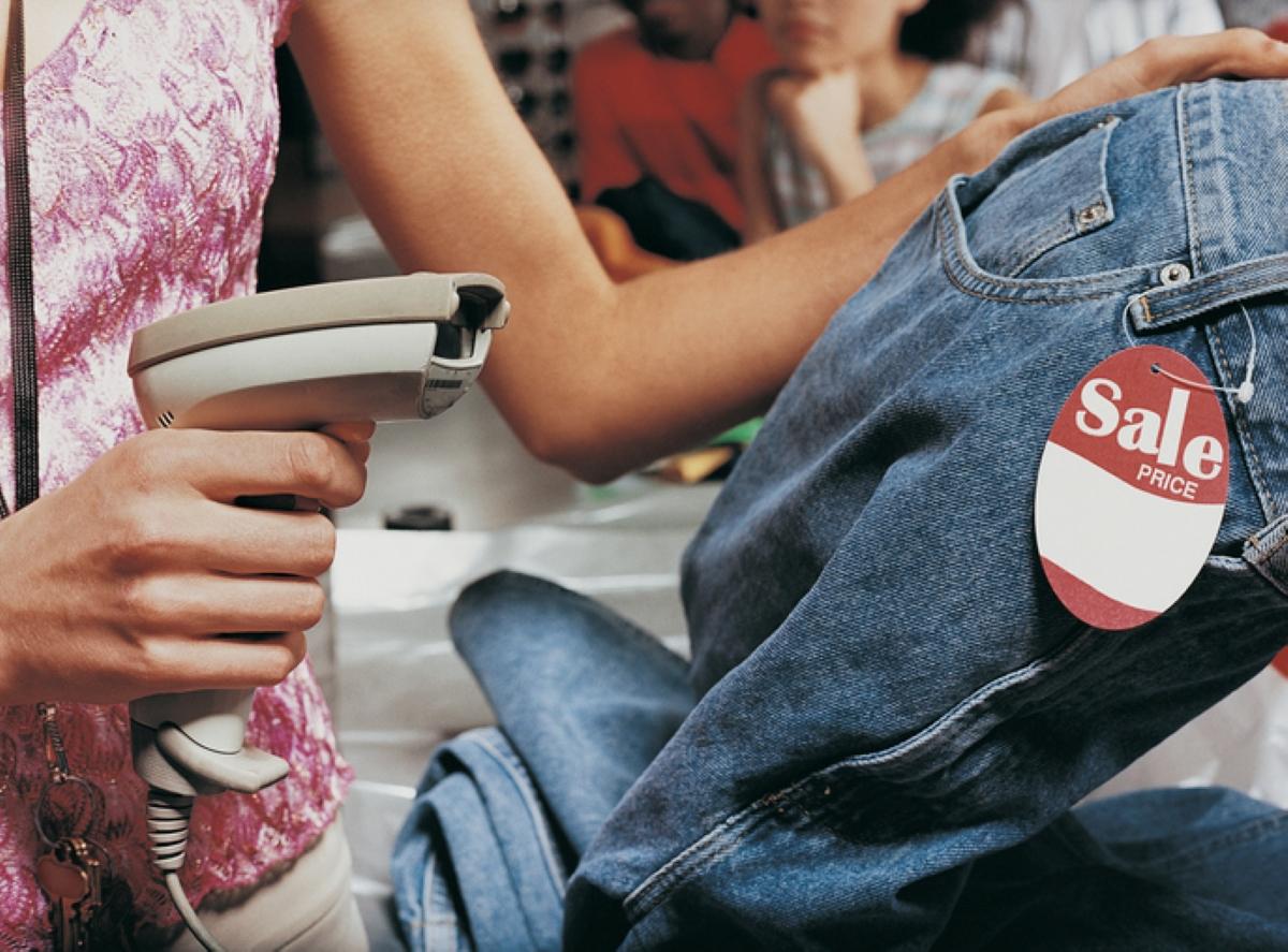 Woman scans clothes at a store