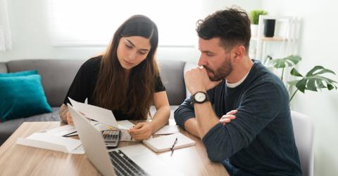 A couple looking a personal loan data for taxes