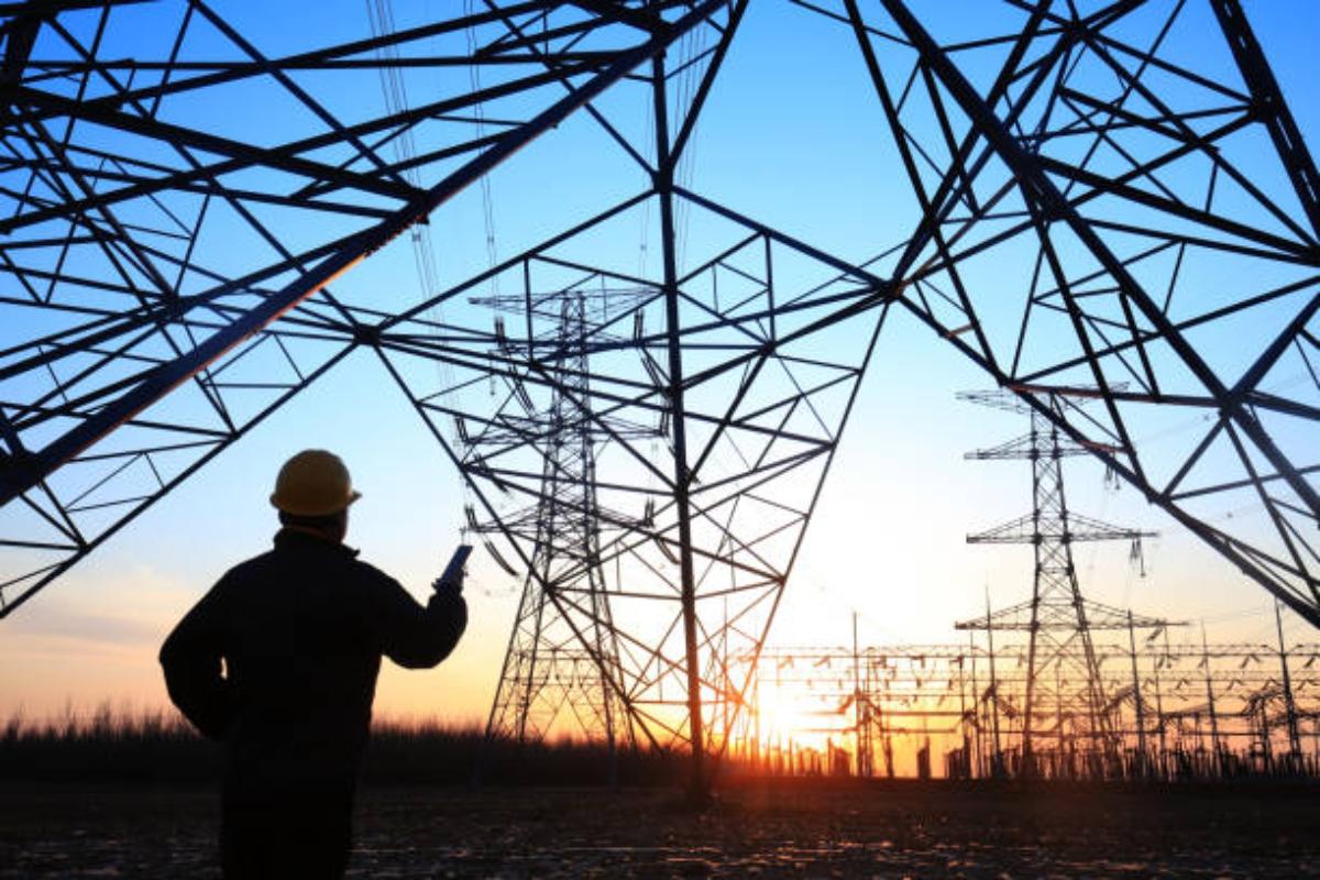 A worker checking power lines