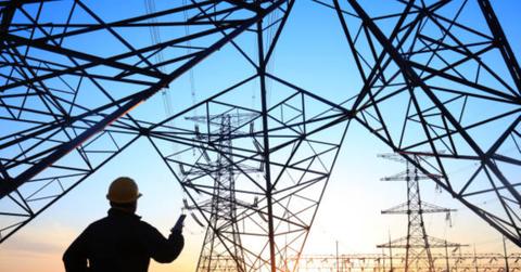 A worker checking power lines