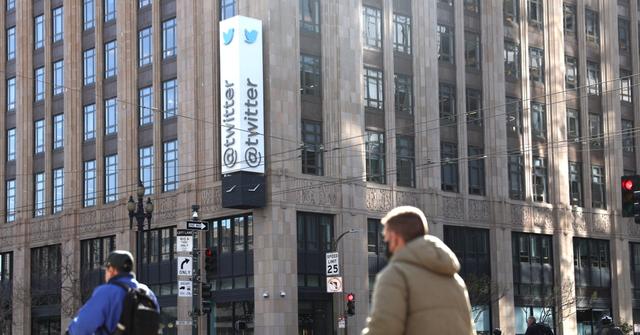 People walking in front of Twitter's headquarters