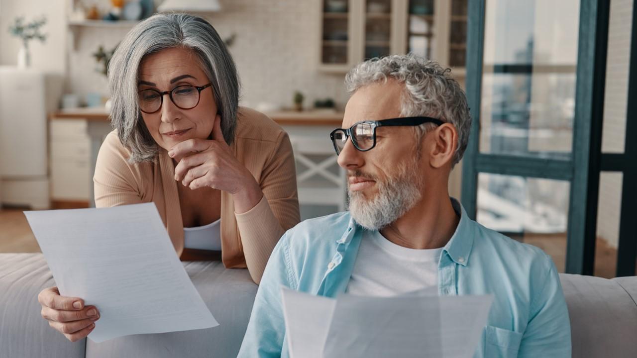 A couple reviewing the 401(k) contribution limit in 2023