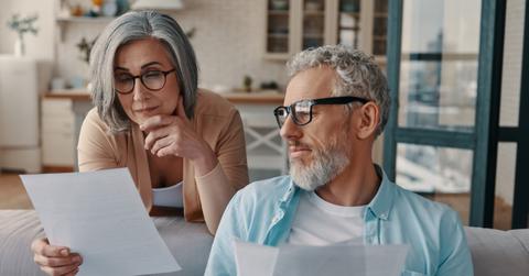 A couple reviewing the 401(k) contribution limit in 2023