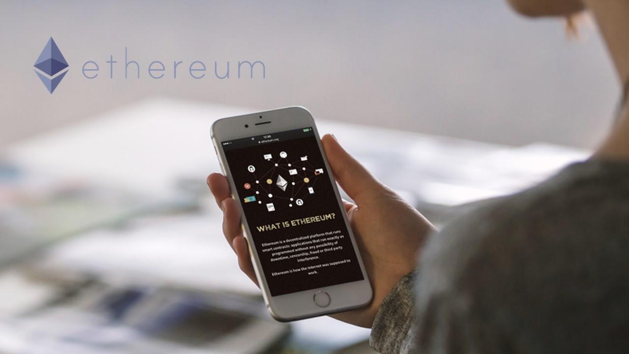 Ethereum logo and a person looking on a smartphone