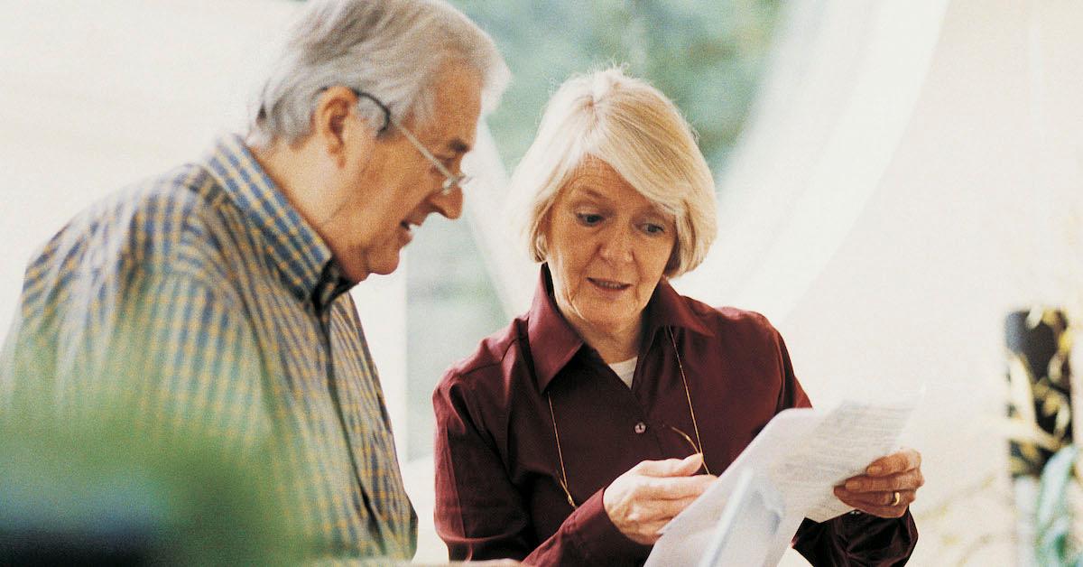 mature couple reviewing paperwork