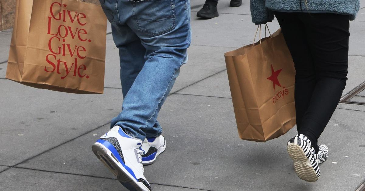 Customers carrying Macy's bags.