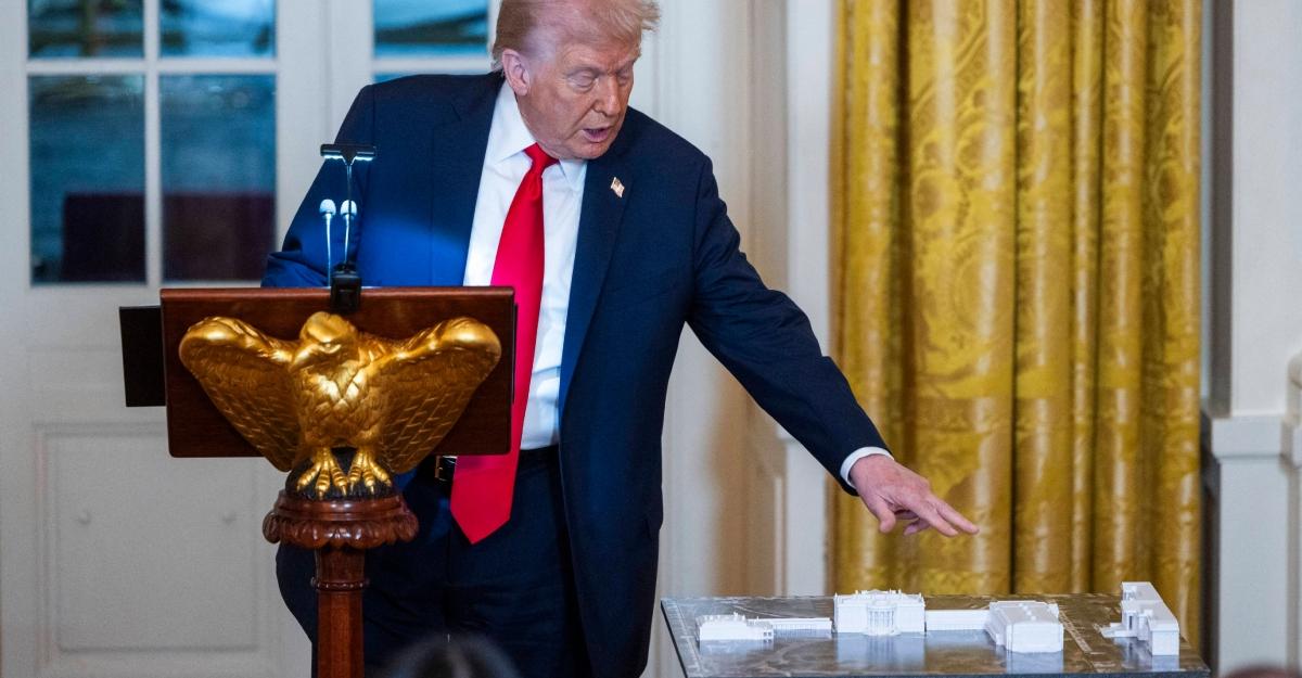 Trump shows models during his ballroom fundraiser