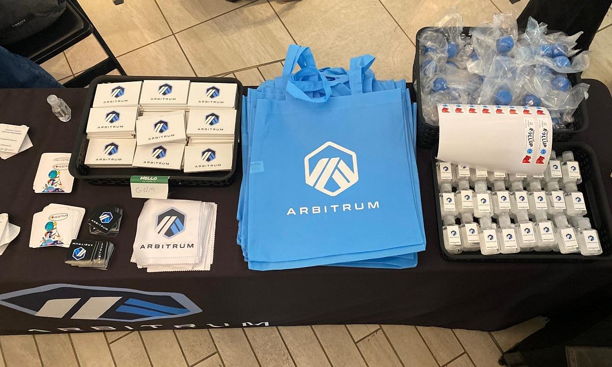 Arbitrum stickers, sanitizer, gum, and a bag to hold it all