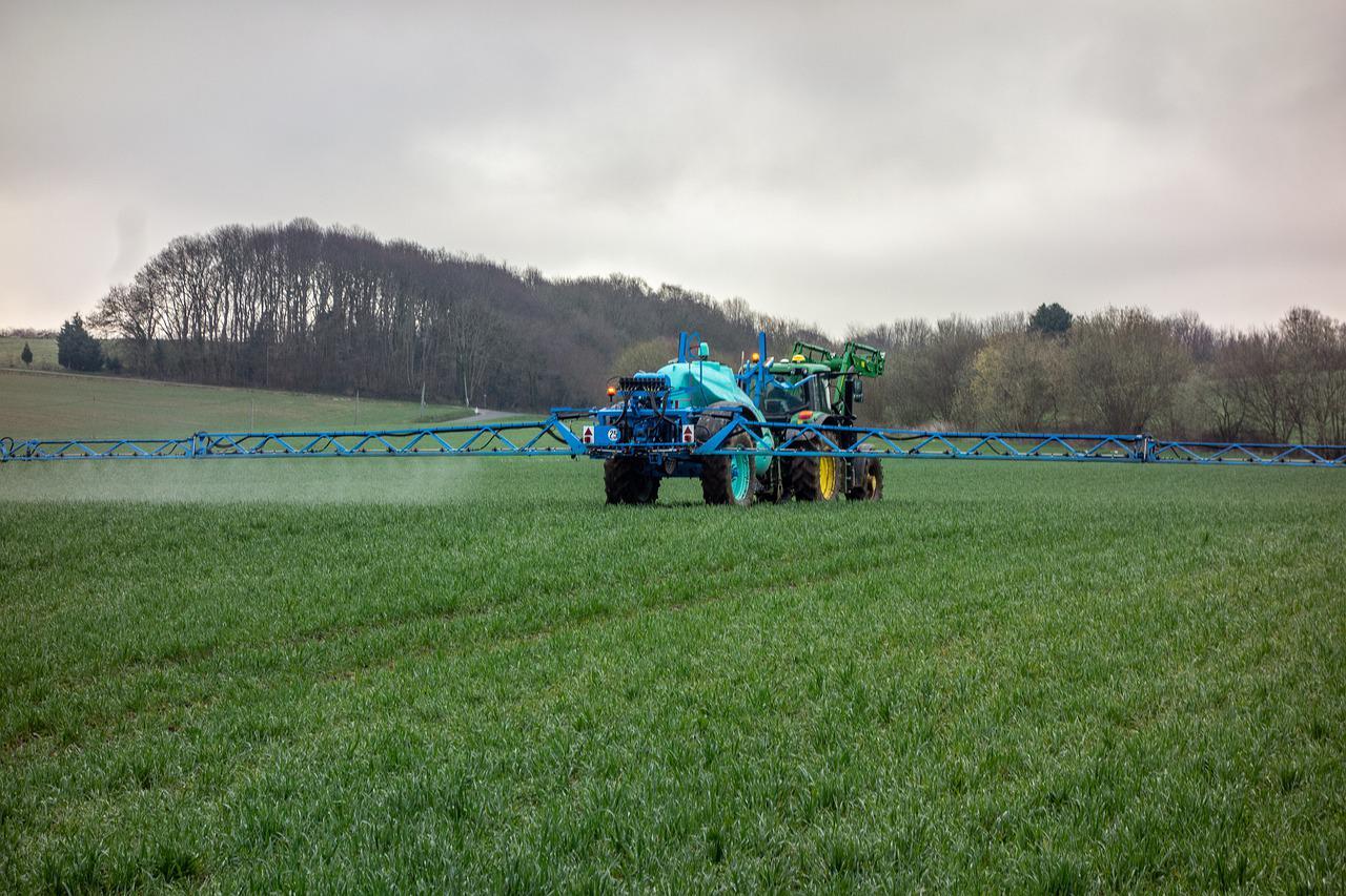 Tractor doing fertilizer and pesticide spray