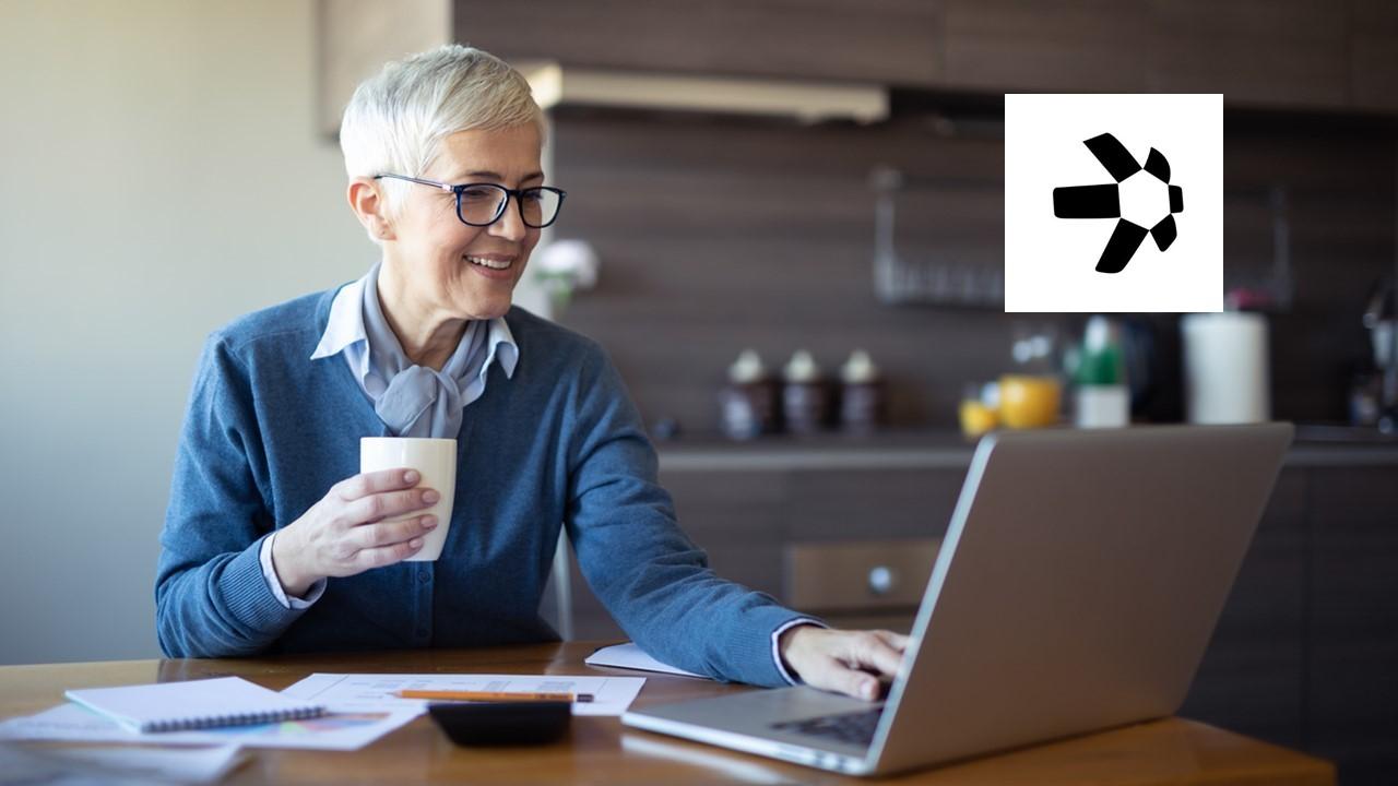 Woman looking on a laptop and Quant logo