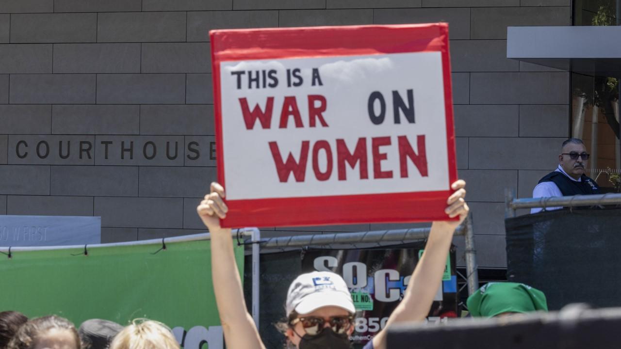 A woman protesting for women's rights