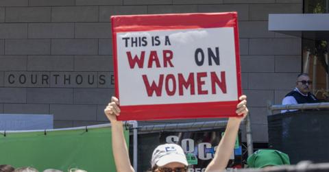A woman protesting for women's rights