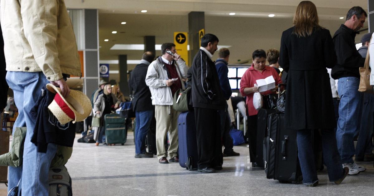 travelers waiting in life for airline check-in