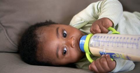 A baby drinking from a bottle