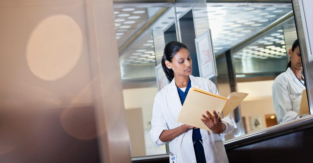 A doctor viewing patient chart