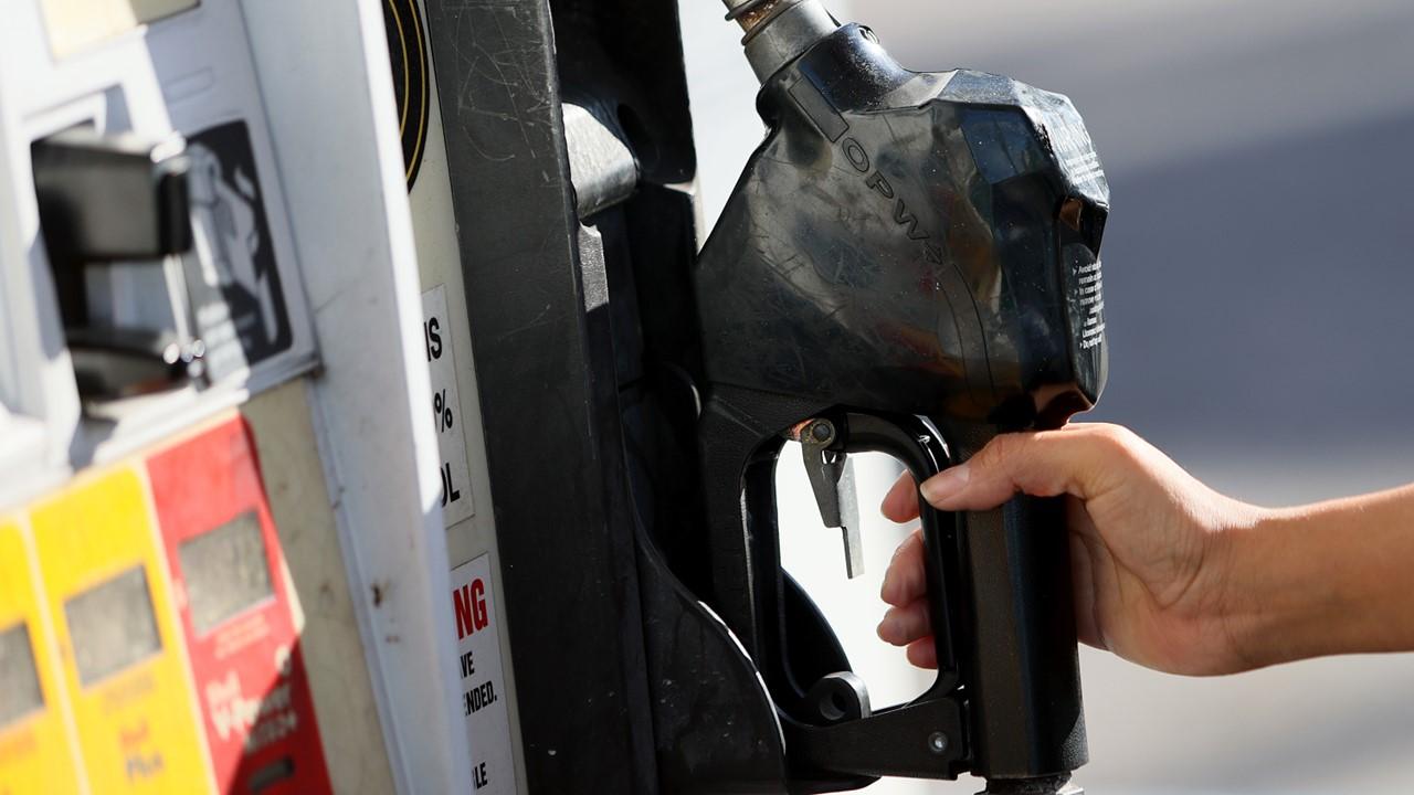 A person using a gas pump