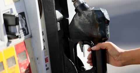 A person using a gas pump