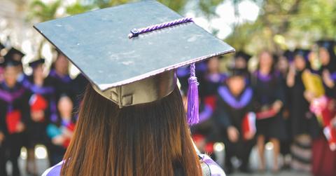 Student in a mortarboard attends graduation ceremony