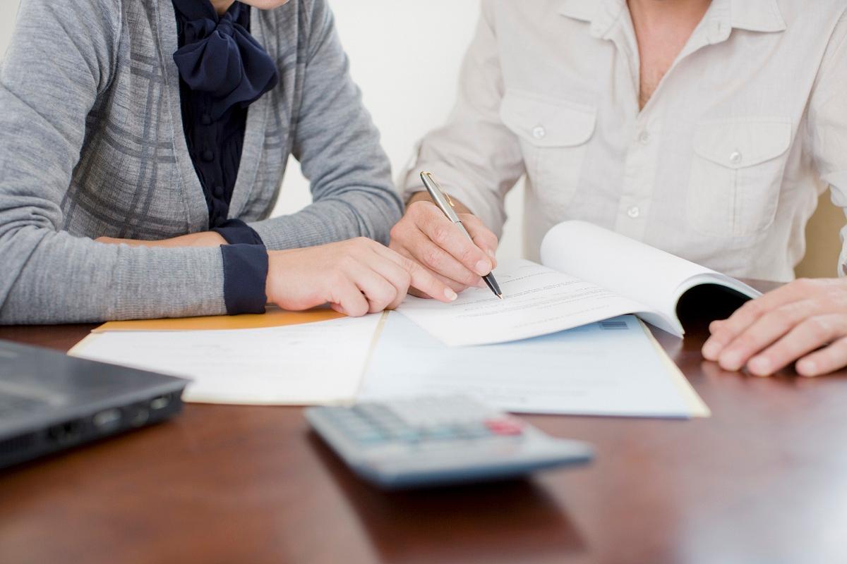 Women reviewing 401(k) paperwork