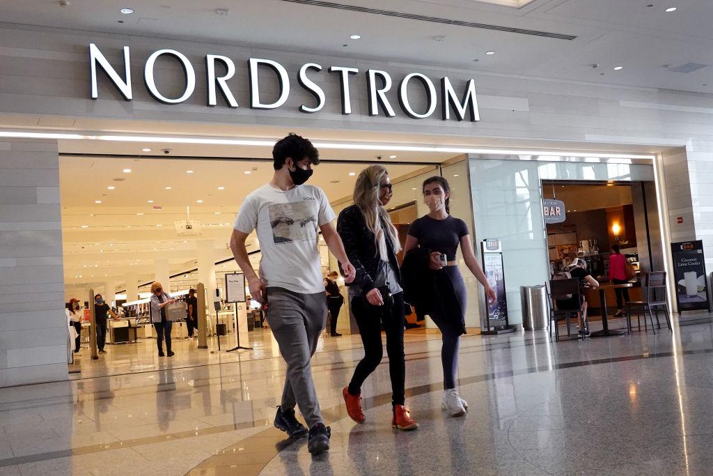 People walking in front of a Nordstrom store