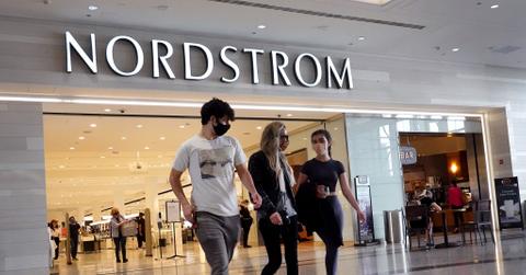 People walking in front of a Nordstrom store
