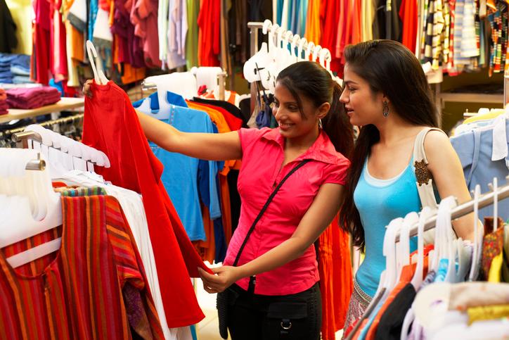 Women looking at clothing in a thrift store