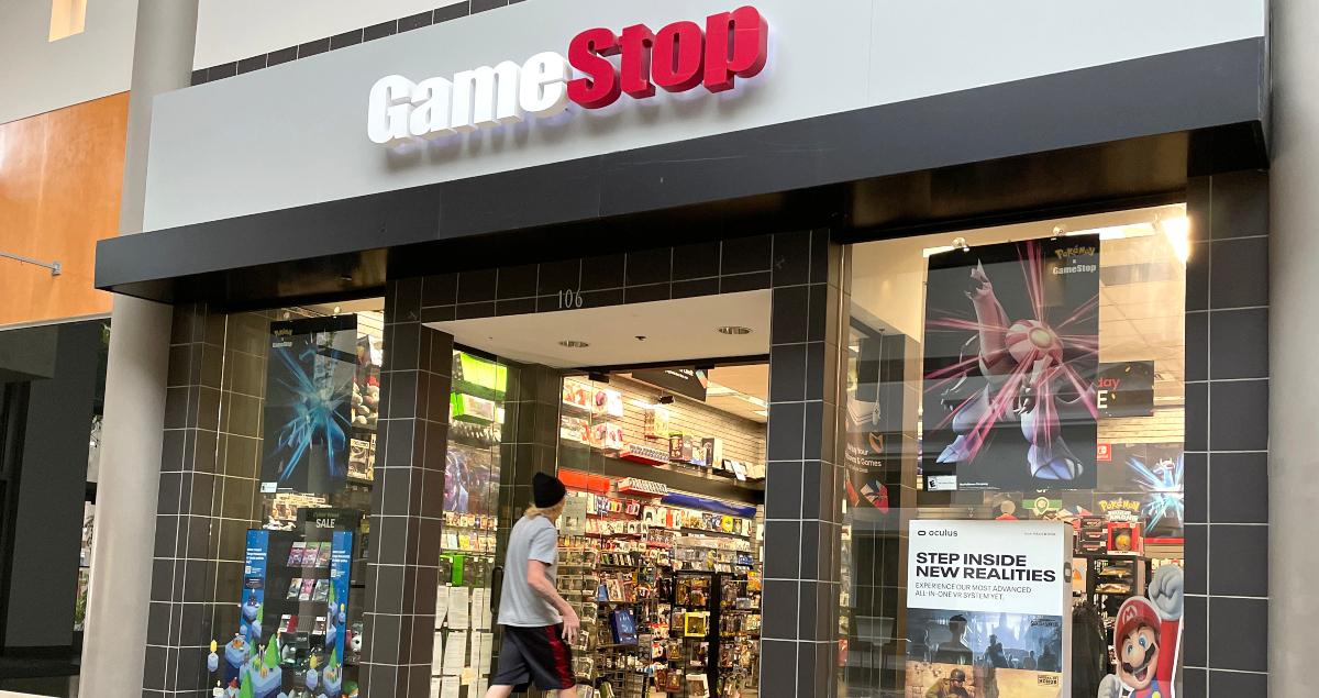 A customer enters a GameStop store