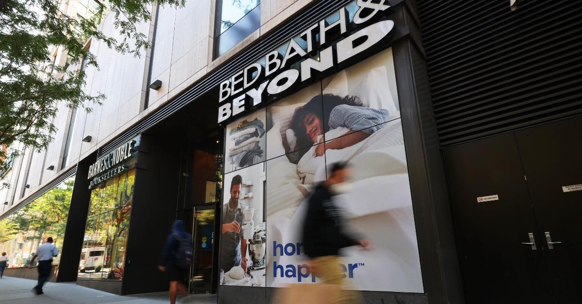 People walking in front of a Bed Bath & Beyond store