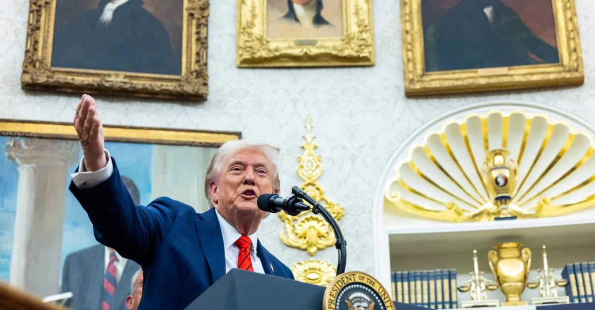 Trump gestures at a press conference in the White House
