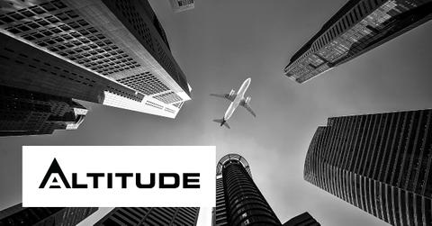 Jet flying over skyscrapers with Altitude logo