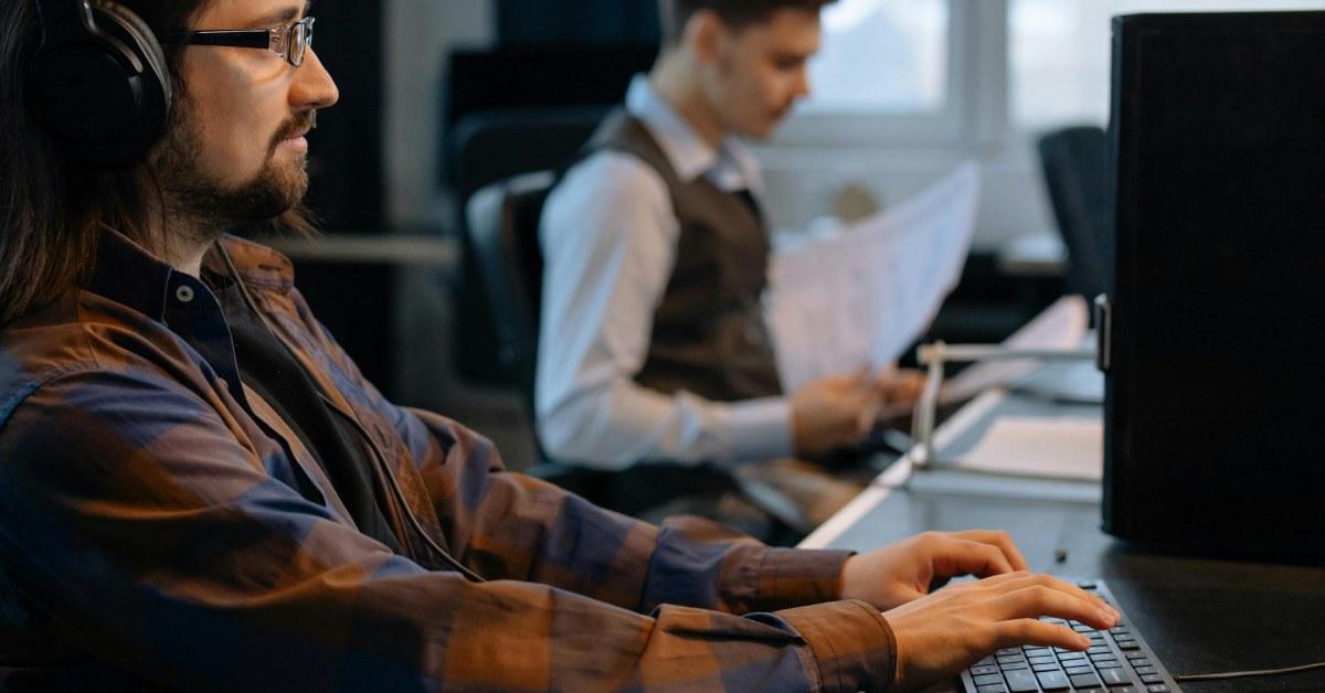 Guy typing on a keyboard.