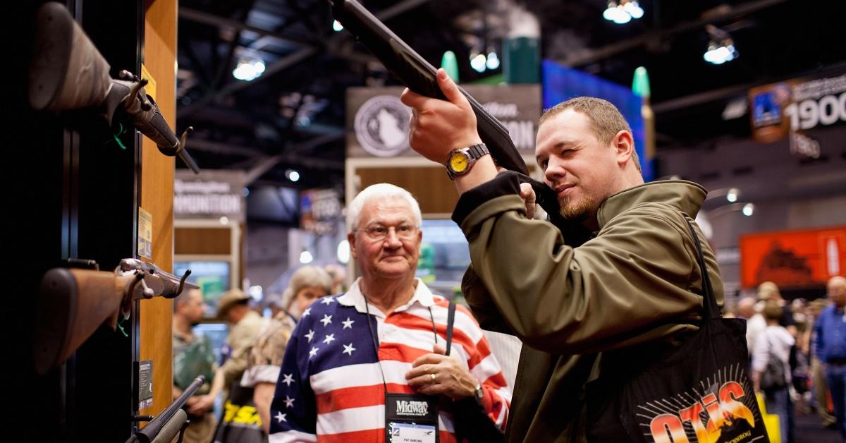 A customer holding a Remington firearm.