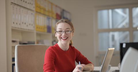 A woman searching online for college scholarships