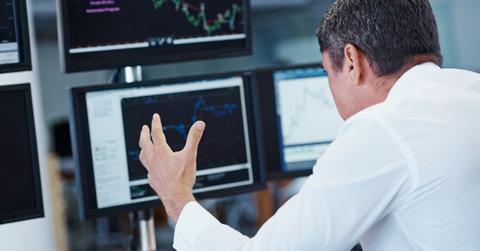 Person looking at charts on screen