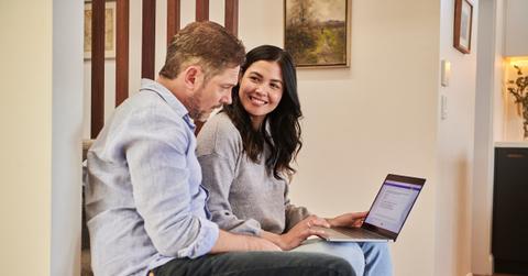 A couple working together on a computer