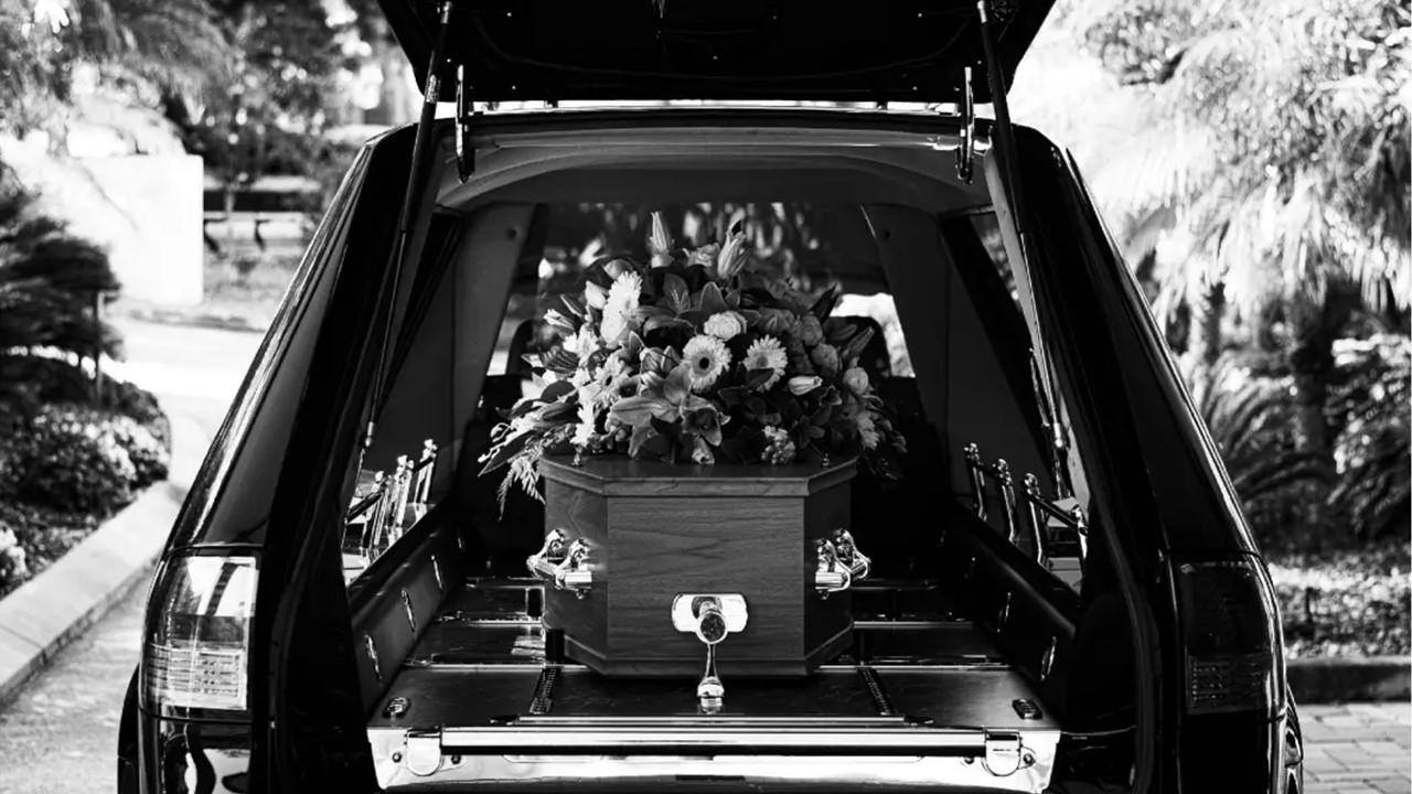 A hearse with a coffin inside.