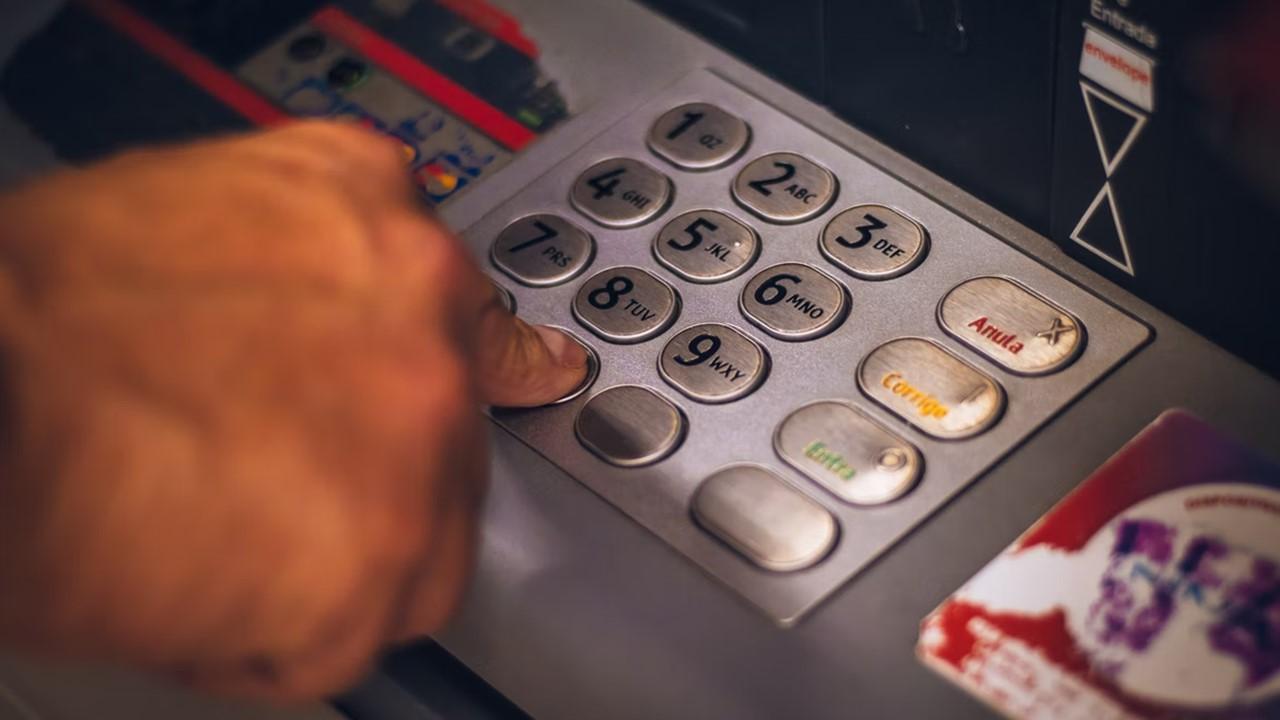 A person using an ATM