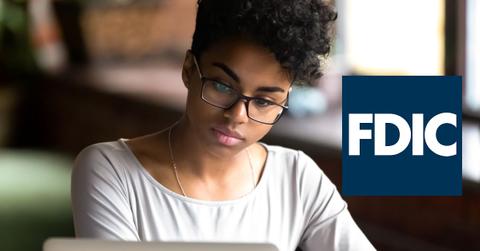 Woman using a laptop and FDIC logo