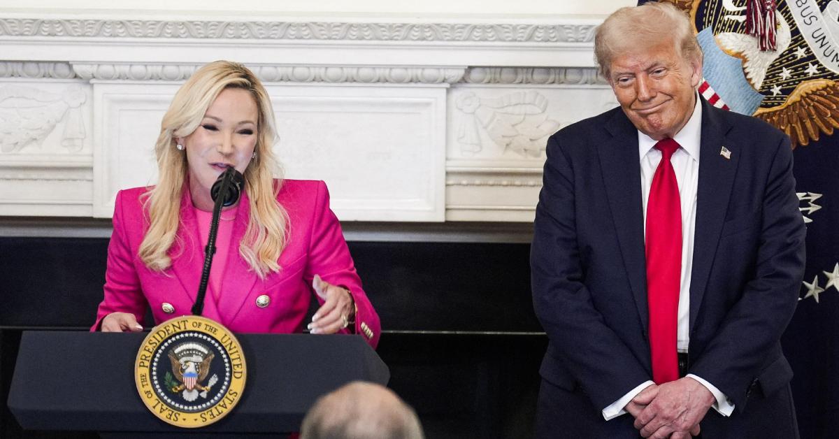 Paula White-Cain speaking next to Donald Trump.